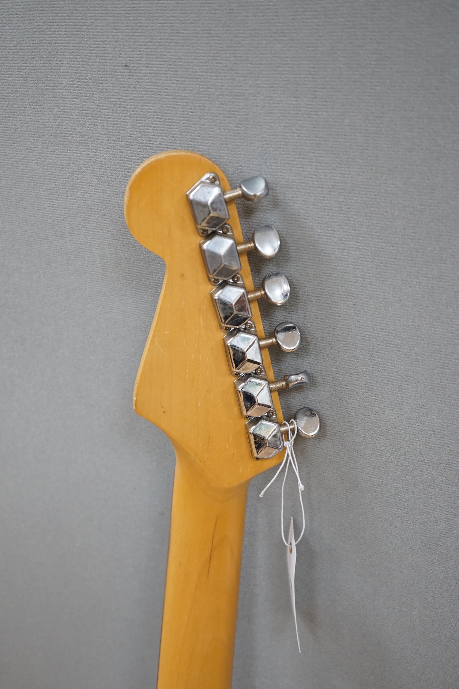 A Collins Sunburst electric guitar with hard flight case